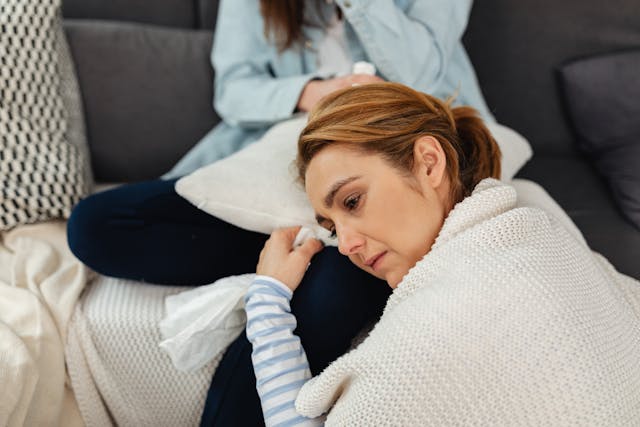 woman crying on someones lap 